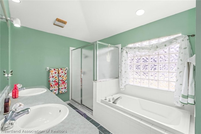 bathroom featuring tile patterned floors, vanity, and independent shower and bath