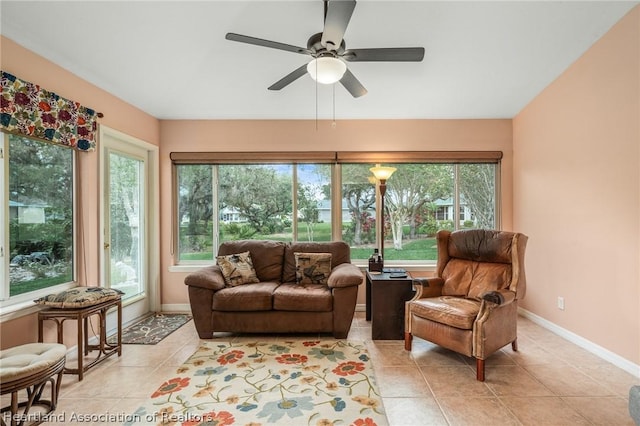 sunroom featuring ceiling fan