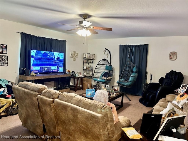 carpeted living room with ceiling fan