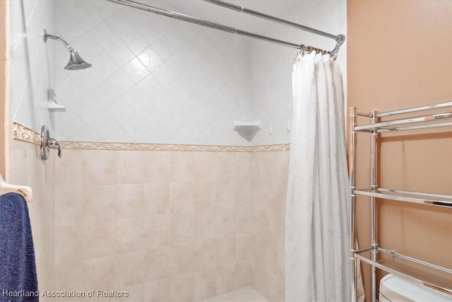 bathroom with a shower with shower curtain