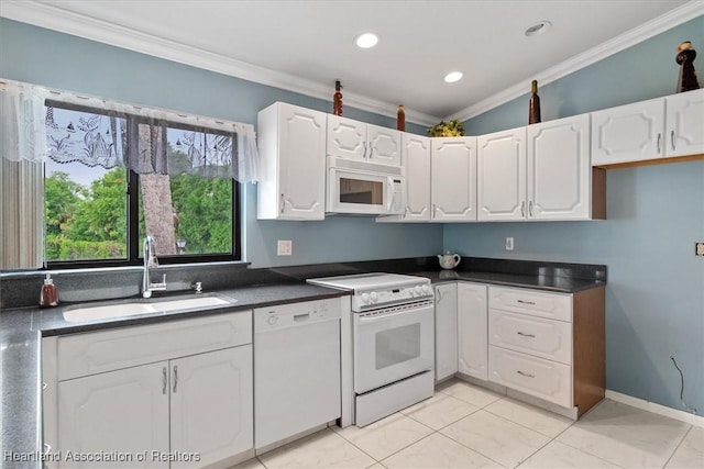 kitchen featuring white appliances, white cabinets, crown molding, sink, and light tile patterned floors