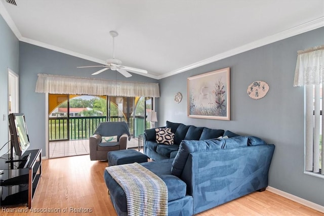 living room with ceiling fan, hardwood / wood-style floors, lofted ceiling, and ornamental molding