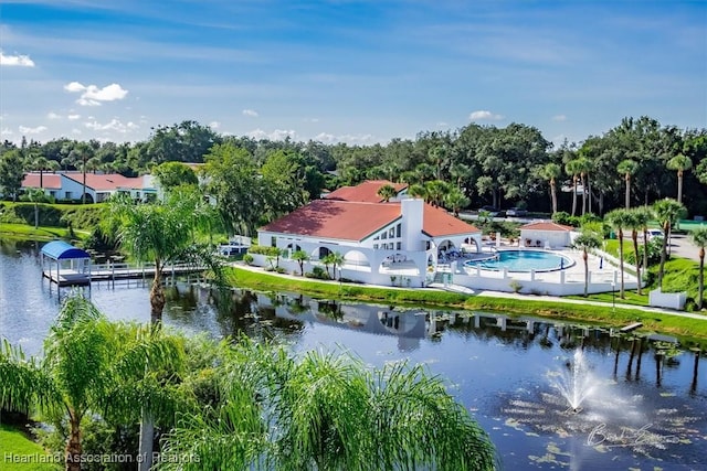 birds eye view of property with a water view