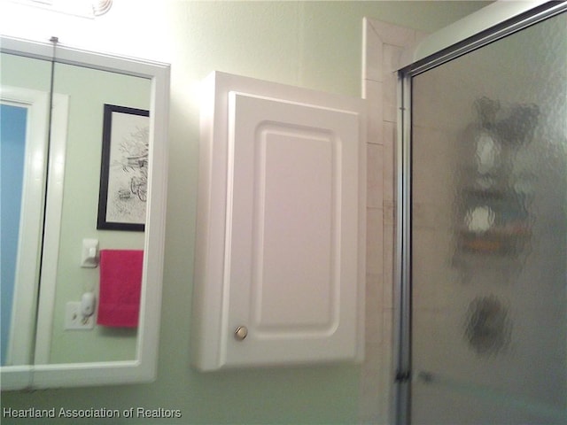 bathroom featuring an enclosed shower