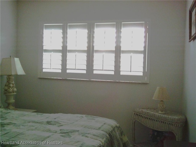 bedroom with multiple windows