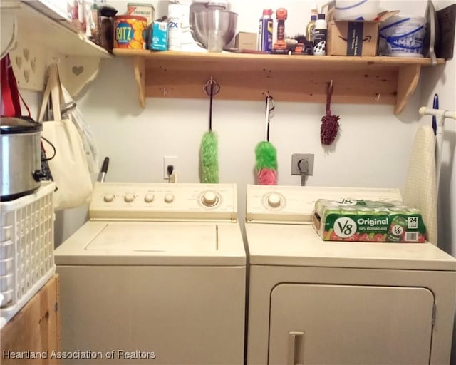 washroom featuring washing machine and clothes dryer and laundry area