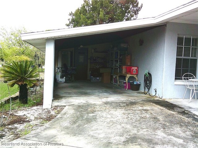 garage with concrete driveway