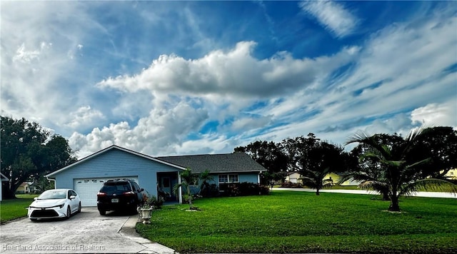 view of front of house featuring a garage and a front lawn