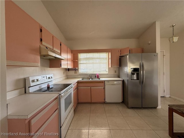 kitchen with a sink, white appliances, light countertops, under cabinet range hood, and light tile patterned floors