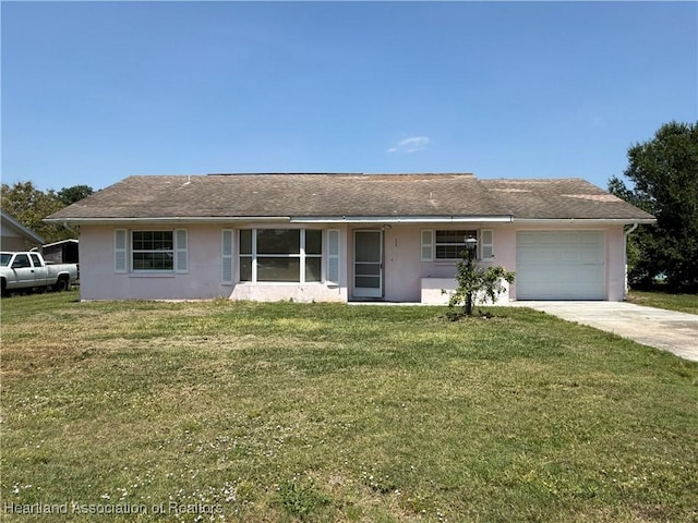 ranch-style home featuring concrete driveway, a front lawn, a garage, stucco siding, and roof with shingles