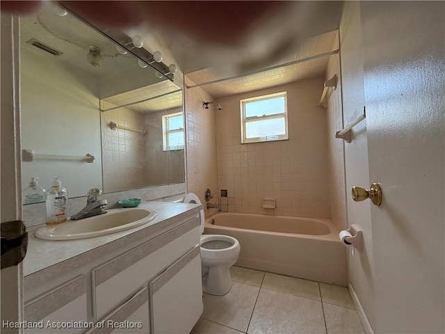 full bathroom with tile patterned flooring, visible vents, toilet, vanity, and shower / bathing tub combination