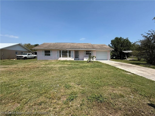 ranch-style home with concrete driveway, stucco siding, a front yard, and a garage