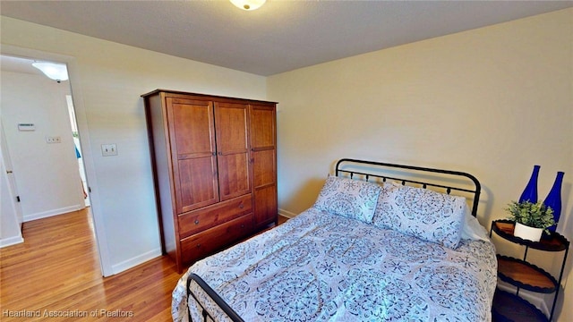 1244 Kelly Ct, Wauchula, FL 33873 - bedroom featuring light wood-style flooring and baseboards
