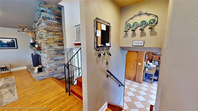 1244 Kelly Ct, Wauchula, FL 33873 - stairway featuring a textured wall and wood finished floors