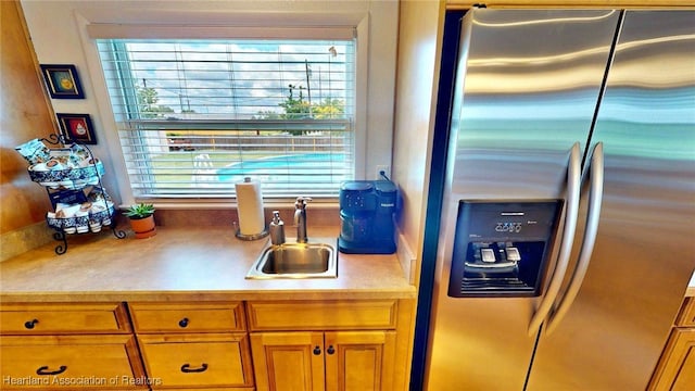 1244 Kelly Ct, Wauchula, FL 33873 - kitchen featuring stainless steel fridge, brown cabinetry, and light countertops