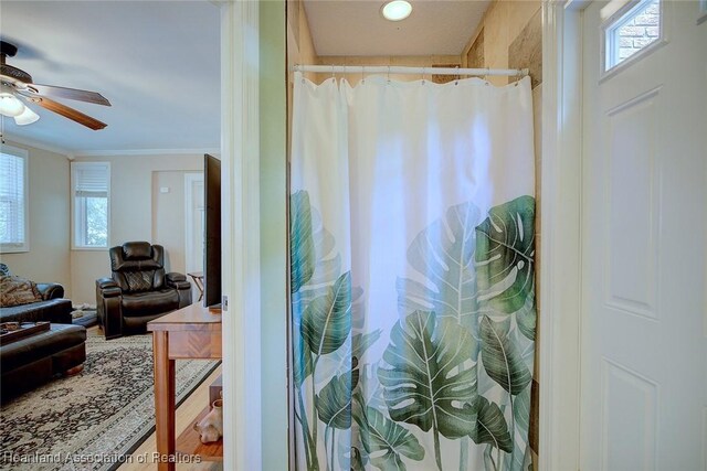 1237 Hotiyee Ave, Sebring, FL 33870 - ensuite bathroom with healthy amount of natural light, crown molding, a ceiling fan, and a shower with shower curtain