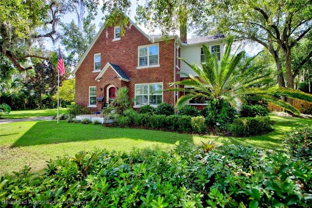 1237 Hotiyee Ave, Sebring, FL 33870 - view of front of property featuring a front yard and brick siding