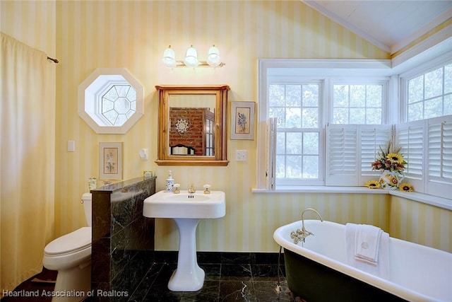 1237 Hotiyee Ave, Sebring, FL 33870 - bathroom featuring wallpapered walls, a freestanding tub, marble tiled flooring, and lofted ceiling