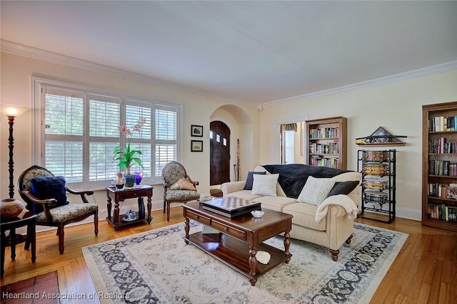 1237 Hotiyee Ave, Sebring, FL 33870 - living area featuring arched walkways, ornamental molding, and wood finished floors