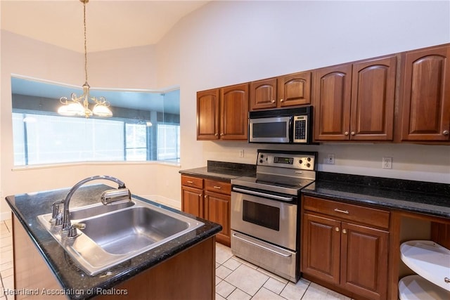 kitchen with a chandelier, decorative light fixtures, vaulted ceiling, light tile patterned floors, and appliances with stainless steel finishes