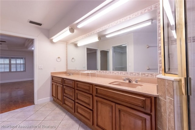 bathroom featuring tile patterned flooring and vanity