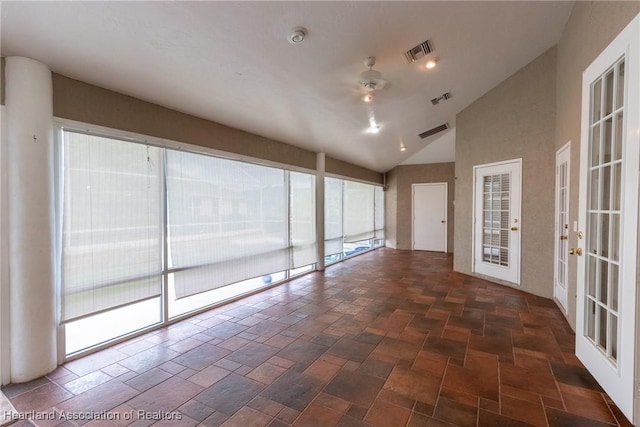 unfurnished sunroom with french doors, vaulted ceiling, and ceiling fan