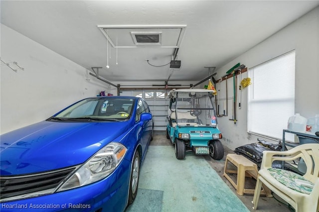 garage featuring a garage door opener