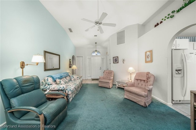 living room featuring ceiling fan, light tile patterned floors, and high vaulted ceiling