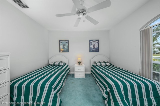 bedroom with ceiling fan and light colored carpet