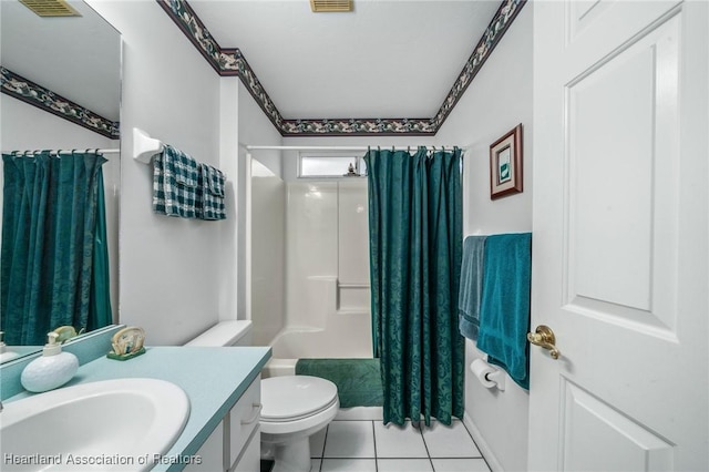 full bathroom featuring toilet, vanity, tile patterned floors, and shower / tub combo with curtain