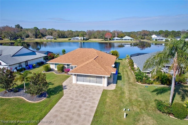 birds eye view of property with a water view