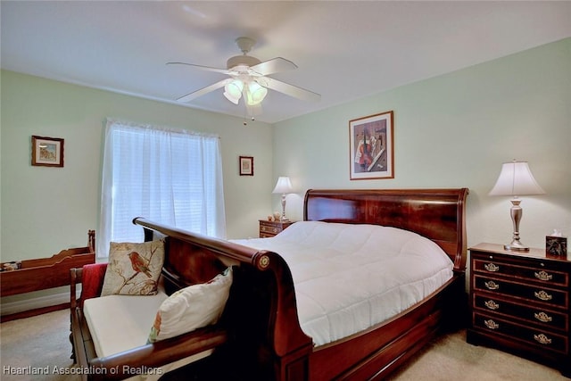 carpeted bedroom with ceiling fan