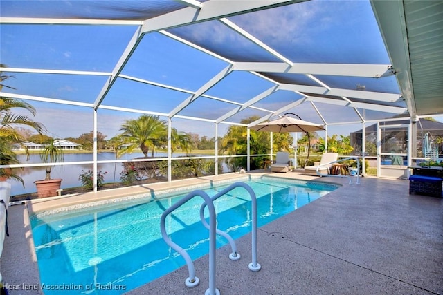 view of swimming pool with a water view, glass enclosure, and a patio area