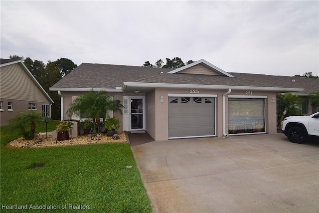 single story home featuring a garage and a front lawn