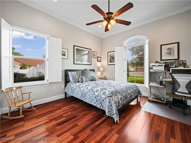 bedroom featuring ceiling fan, crown molding, and dark wood-type flooring