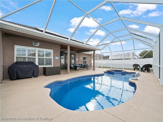 view of swimming pool featuring an in ground hot tub, a patio, grilling area, and a lanai