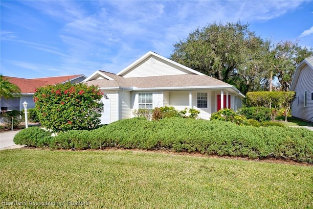 3171 E Pebble Dr, Avon Park, FL 33825 - ranch-style house with a front lawn and roof with shingles