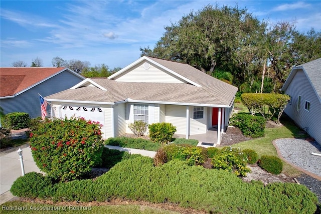 3171 E Pebble Dr, Avon Park, FL 33825 - single story home with a shingled roof and an attached garage