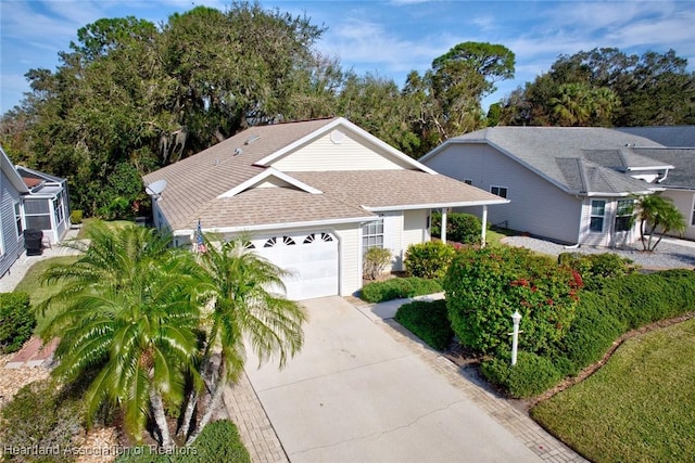3171 E Pebble Dr, Avon Park, FL 33825 - view of front of property with driveway, a garage, and roof with shingles