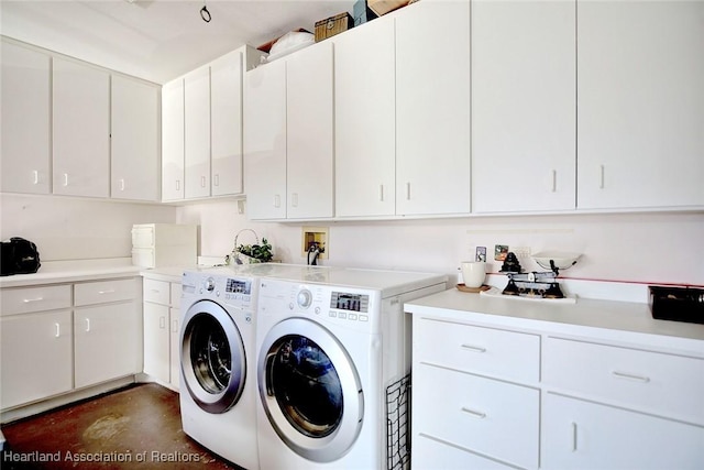 3171 E Pebble Dr, Avon Park, FL 33825 - clothes washing area featuring washing machine and clothes dryer and cabinet space