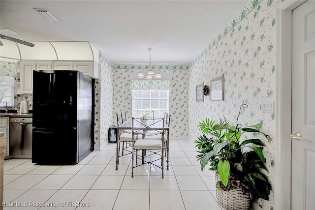3171 E Pebble Dr, Avon Park, FL 33825 - dining space featuring wallpapered walls, light tile patterned flooring, a healthy amount of sunlight, and visible vents