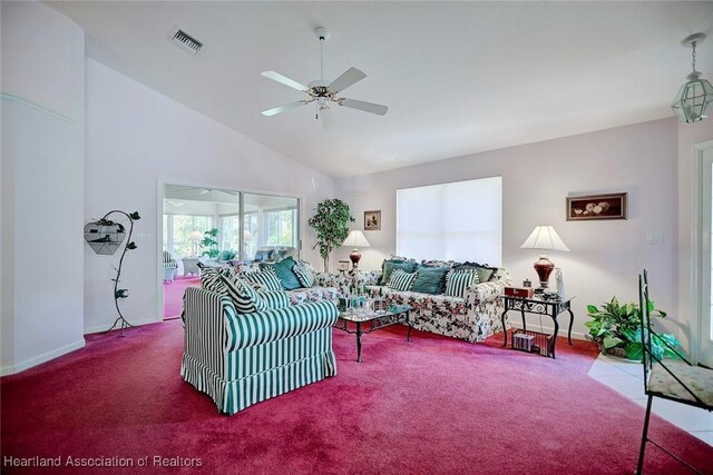 carpeted living room with vaulted ceiling and ceiling fan