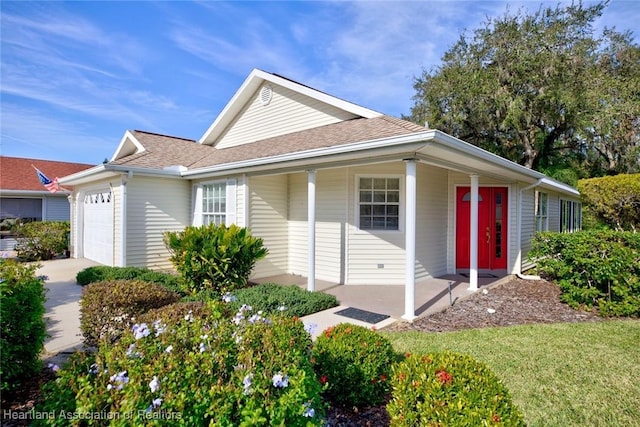 3171 E Pebble Dr, Avon Park, FL 33825 - ranch-style home with covered porch, driveway, a garage, and roof with shingles