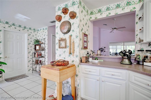 3171 E Pebble Dr, Avon Park, FL 33825 - kitchen featuring wallpapered walls, visible vents, light tile patterned floors, and a ceiling fan
