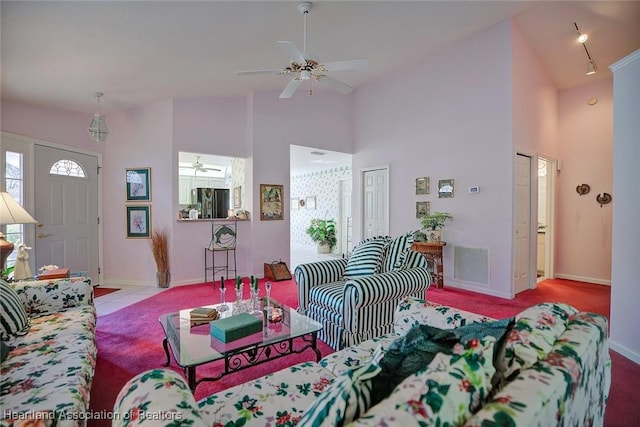 3171 E Pebble Dr, Avon Park, FL 33825 - carpeted living room featuring a ceiling fan, high vaulted ceiling, baseboards, and visible vents