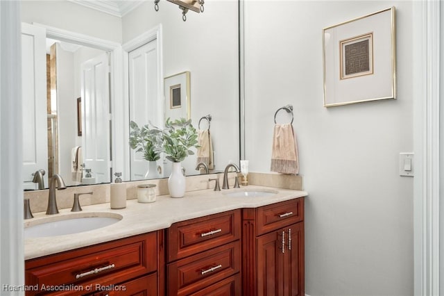 bathroom featuring vanity and ornamental molding