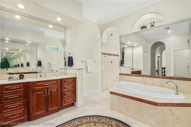 bathroom featuring tiled bath, crown molding, tile patterned flooring, and vanity