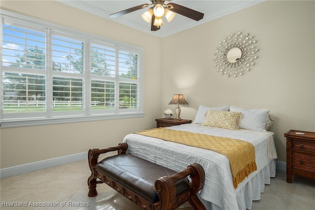 bedroom with ceiling fan, ornamental molding, and light tile patterned flooring