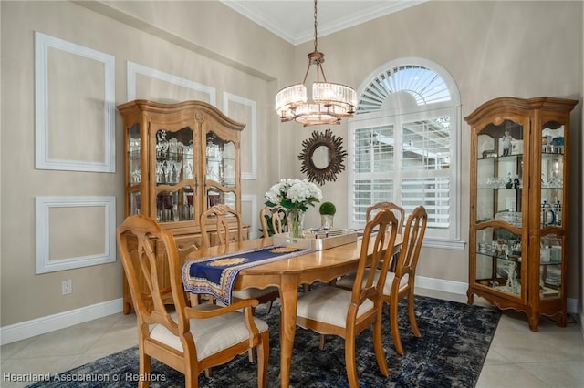 dining space featuring an inviting chandelier, ornamental molding, and light tile patterned flooring