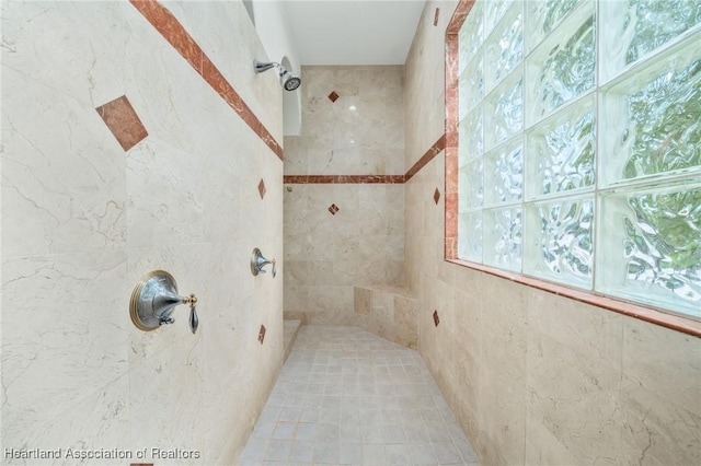 bathroom with tiled shower